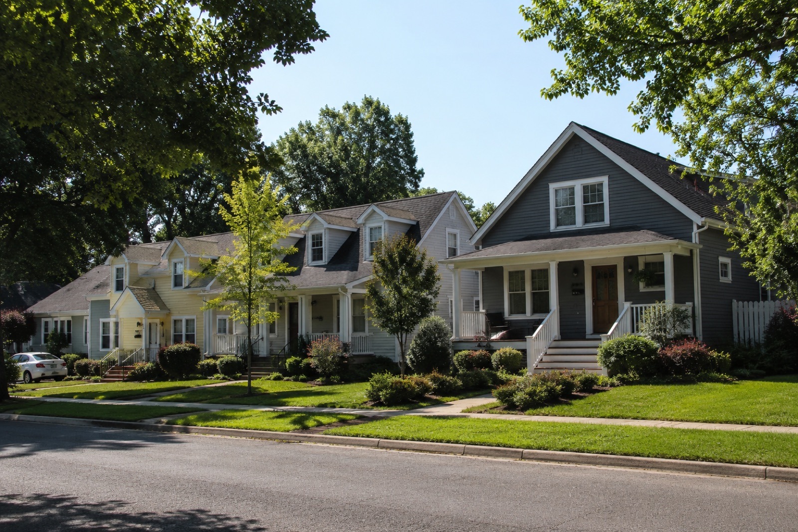 A tree-lined street of craftsman homes